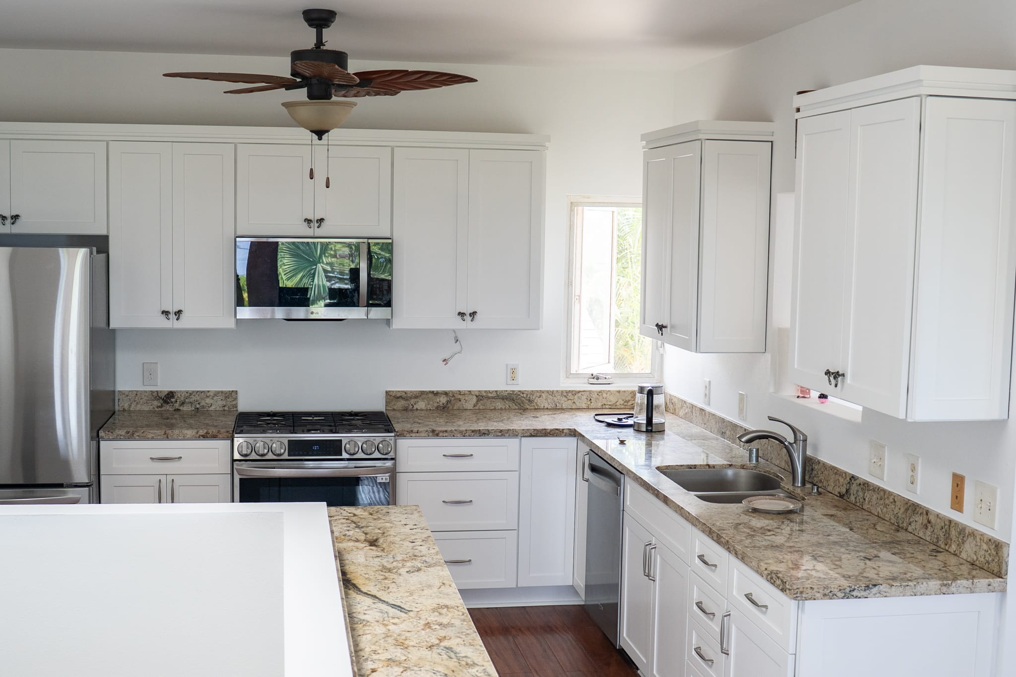 97 Painting Maui, Modern white kitchen with granite countertops